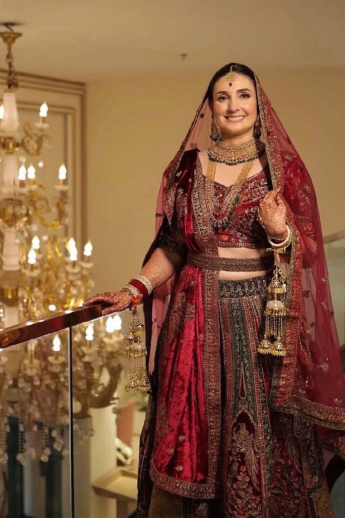 Red designer bridal suit by Urban Darzi