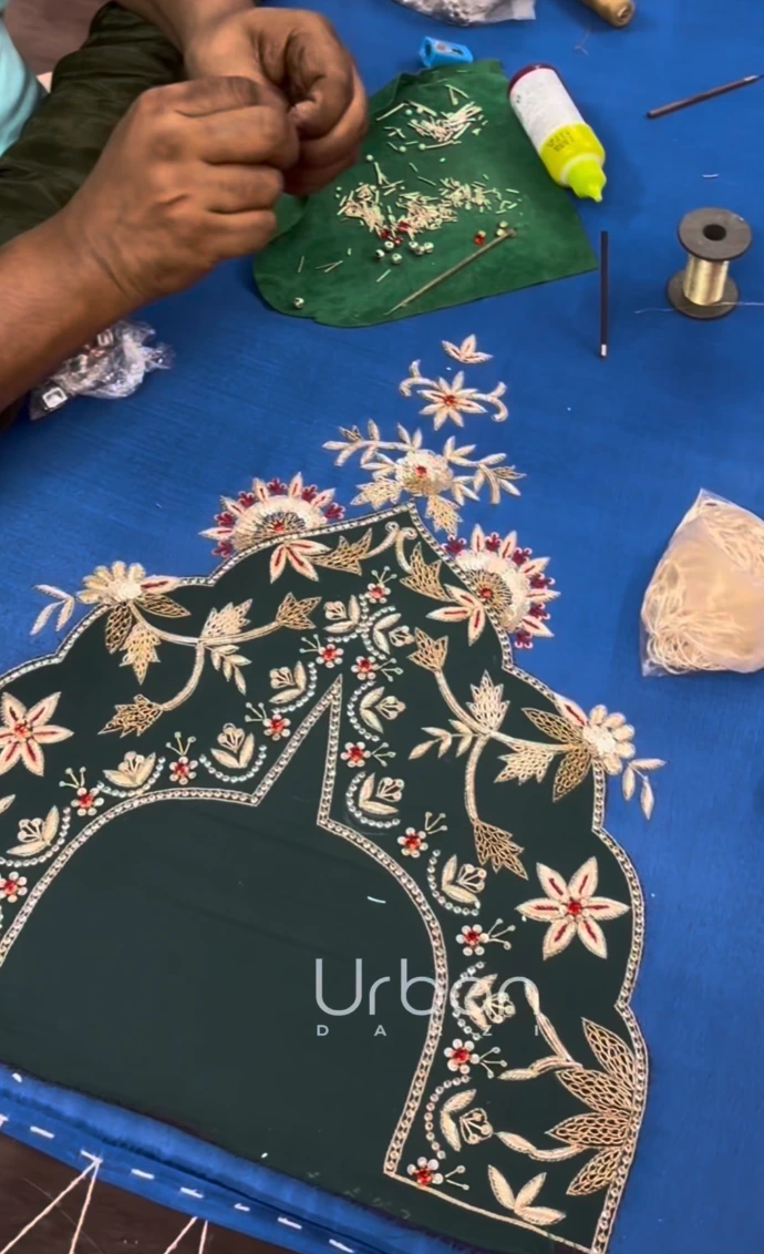 Premium unstitched designer suit featuring intricate Aari and Zardozi hand embroidery by Urban Darzi